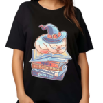 A Cat Sleeping Atop A Stack Of Books On Spells Witchcraft Summoning And Potions 2024 Shirt